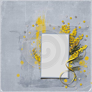 Stylish light gray background with a frame for a photo with a bouquet of yellow mimosa