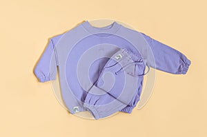 Stylish lilac children's spring, autumn sport costume. Soft touch, warm joggers and sweatshirt. Fashion kids outfit