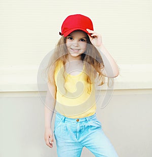 Stylish little cute girl child wearing a cap