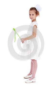 Stylish little girl with a magic wand