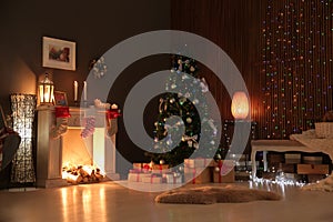 Stylish living room interior with decorated Christmas tree