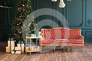 Stylish loft living room interior with decorated Christmas tree, decorative trolley with gifts and pink sofa