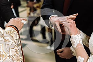 Stylish luxury bride and elegant groom, making oaths, emotional