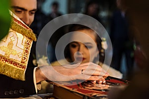 Stylish luxury bride and elegant groom, making oaths, emotional