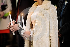 Stylish luxury bride and elegant groom, making oaths, emotional