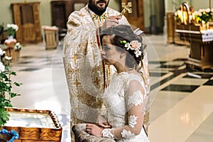 Stylish luxury bride and elegant groom, making oaths, emotional