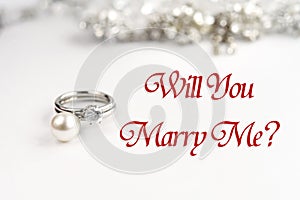 Stylish luxury rings, will you marry me text, greeting card conc