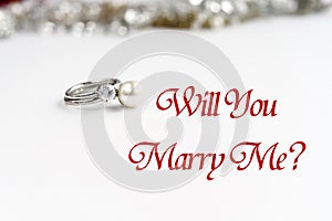 Stylish luxury rings, will you marry me text, greeting card conc