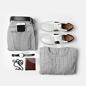 Stylish male autumn outfit and accessories on background, flat lay. Trendy warm clothes