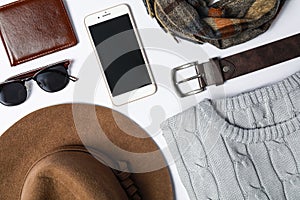 Stylish male autumn outfit and accessories on background, flat lay. Trendy warm clothes