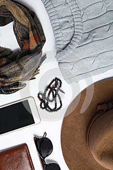 Stylish male autumn outfit and accessories on ite background, flat lay. Trendy warm clothes
