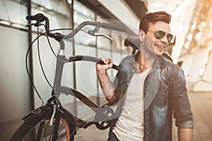 Stylish man with bicycle