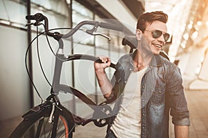 Stylish man with bicycle photo
