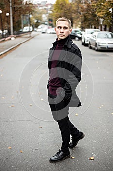 Stylish man in black trenchcoat