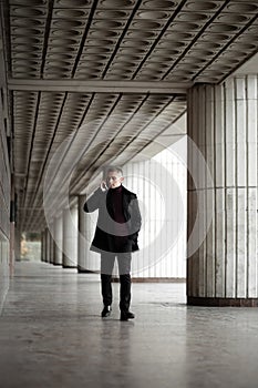 Stylish man in black trenchcoat