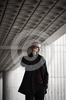 Stylish man in black trenchcoat