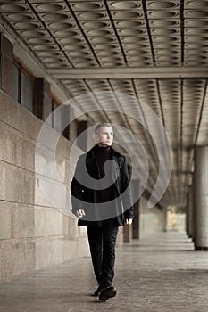 Stylish man in black trenchcoat