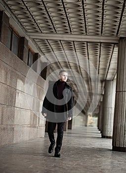 Stylish man in black trenchcoat