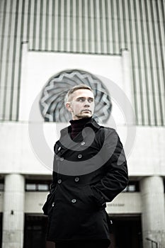 Stylish man in black trenchcoat