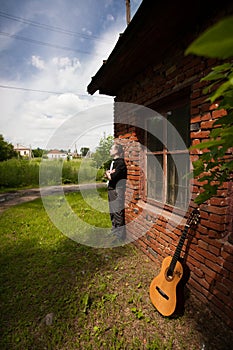 Stylish man with guitar photo