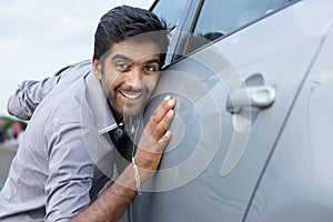 Stylish man obsessed with new car safety