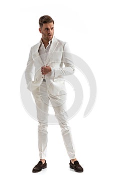 Stylish man with open collar shirt holding hand in pocket
