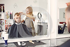 Stylish man sitting in a barbershop