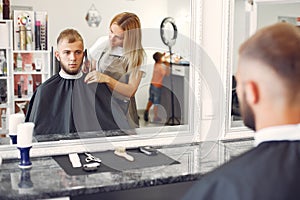 Stylish man sitting in a barbershop