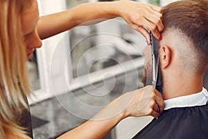 Stylish man sitting in a barbershop