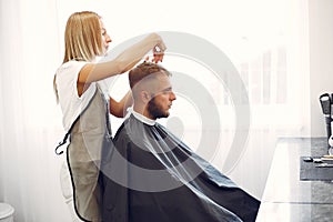 Stylish man sitting in a barbershop