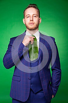 Stylish man in suit and tie made of green leaf