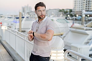 Stylish man wearing sunglasses and shirt. Handsome man outdoors portrait. Portrait of stylish male model outdoor