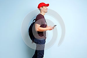 Stylish mature man against blue wall