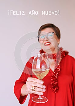 stylish mature senior woman in red blouse with glass