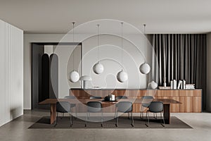 Stylish meeting room interior with office table, chairs and drawer with decor