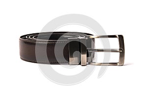 stylish men& x27;s brown leather belt with nickel buckle on a white background