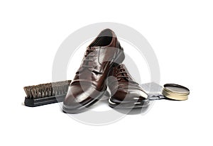 Stylish men`s footwear and shoe care accessories on white