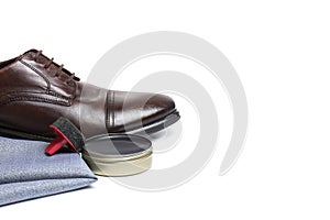 Stylish men`s footwear and shoe care accessories on white background