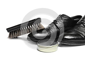 Stylish men`s footwear and shoe care accessories on white background