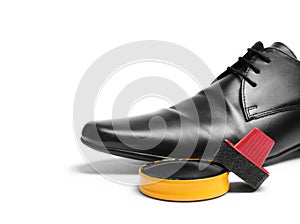Stylish men`s footwear and shoe care accessories on white background