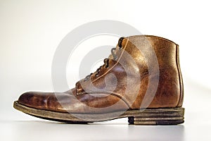 Stylish mens shiny leater boot photo