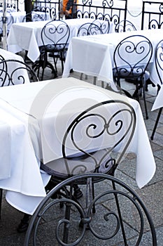 Stylish metal chair and tables at the restaurant