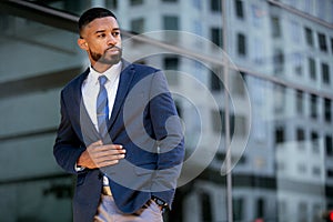 Stylish modern african american businessman, commercial model posing in trendy suit outfit, handsome executive