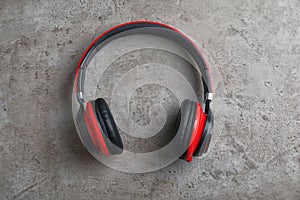 Stylish modern headphones with earmuffs on gray background
