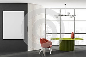 Stylish modern living room interior in skyscraper building with design armchair and green round table, white mock up framed poster