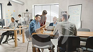 In the Stylish Modern Office: Diverse Group of Enthusiastic Business Marketing Professionals Use C