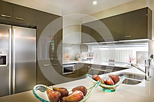 Stylish and modern picture of a kitchen with food placed on shel