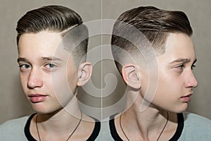 Stylish modern retro haircut side part with mid fade with parting of a school boy guy in a barbershop on a brown background