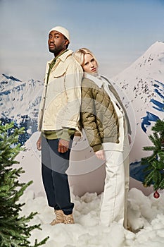 stylish multicultural couple in winter jackets
