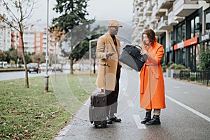 Stylish multiracial business couple walking outdoors discussing work.